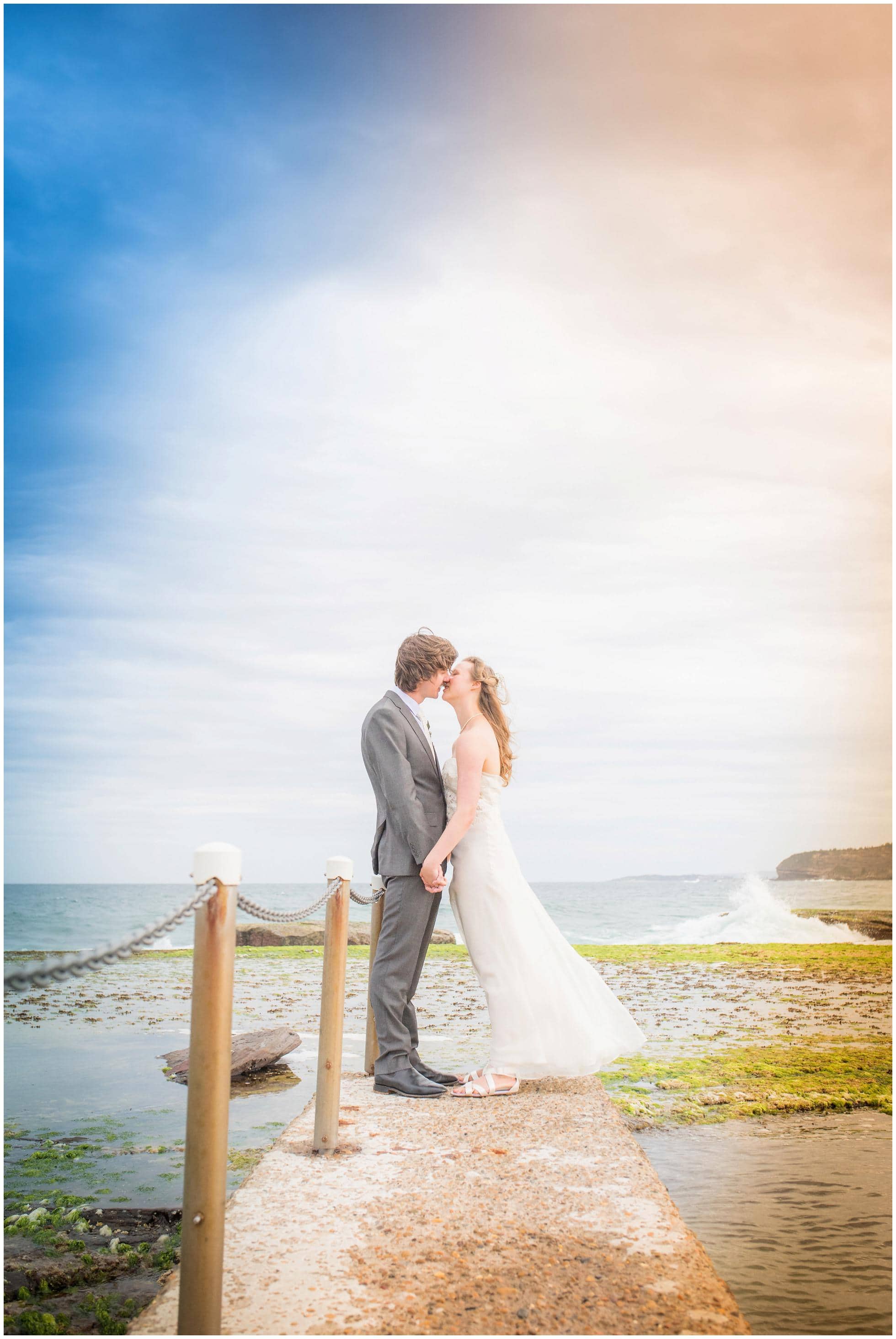 Romantic Mona Vale Wedding Photography on the rocks by the swimming pool.