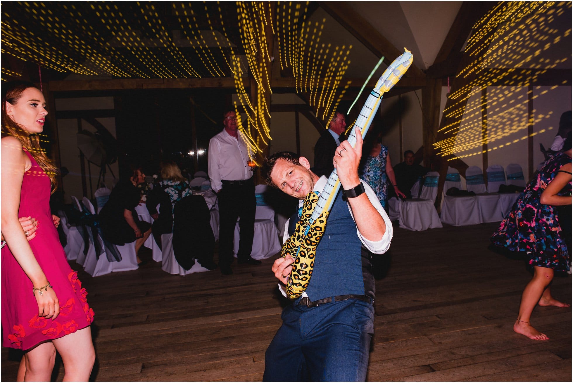 Rock n roll inflatable guitar fun on the dancefloor at Sandburn Hall