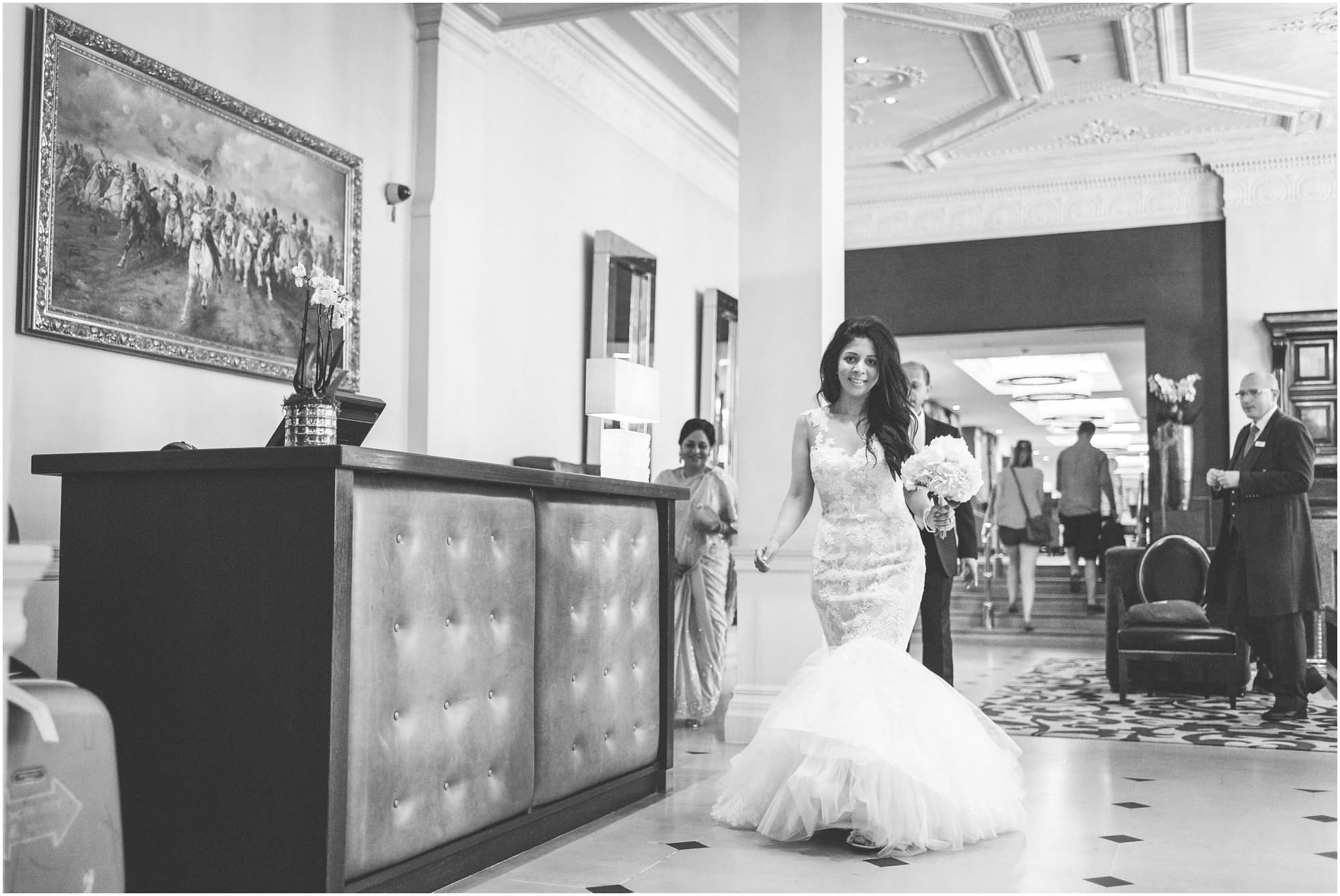 Beautiful bride walks through The Royal Horseguards Hotel to One Whitehall Place.