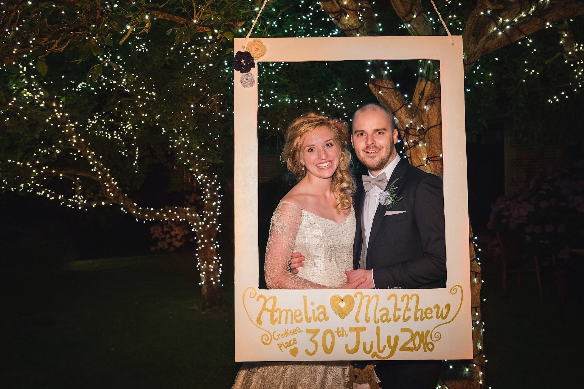 Bride and groom with homemade frame