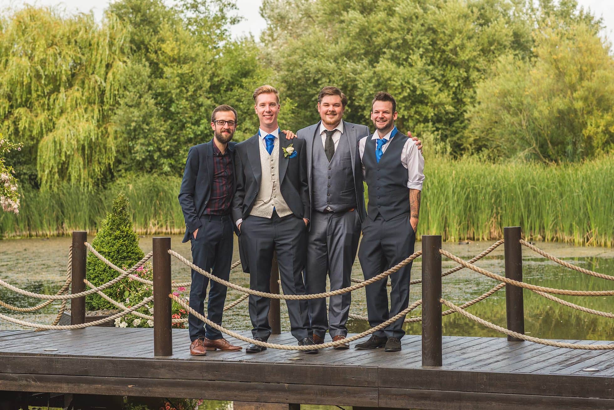 Groom and friends on bridge