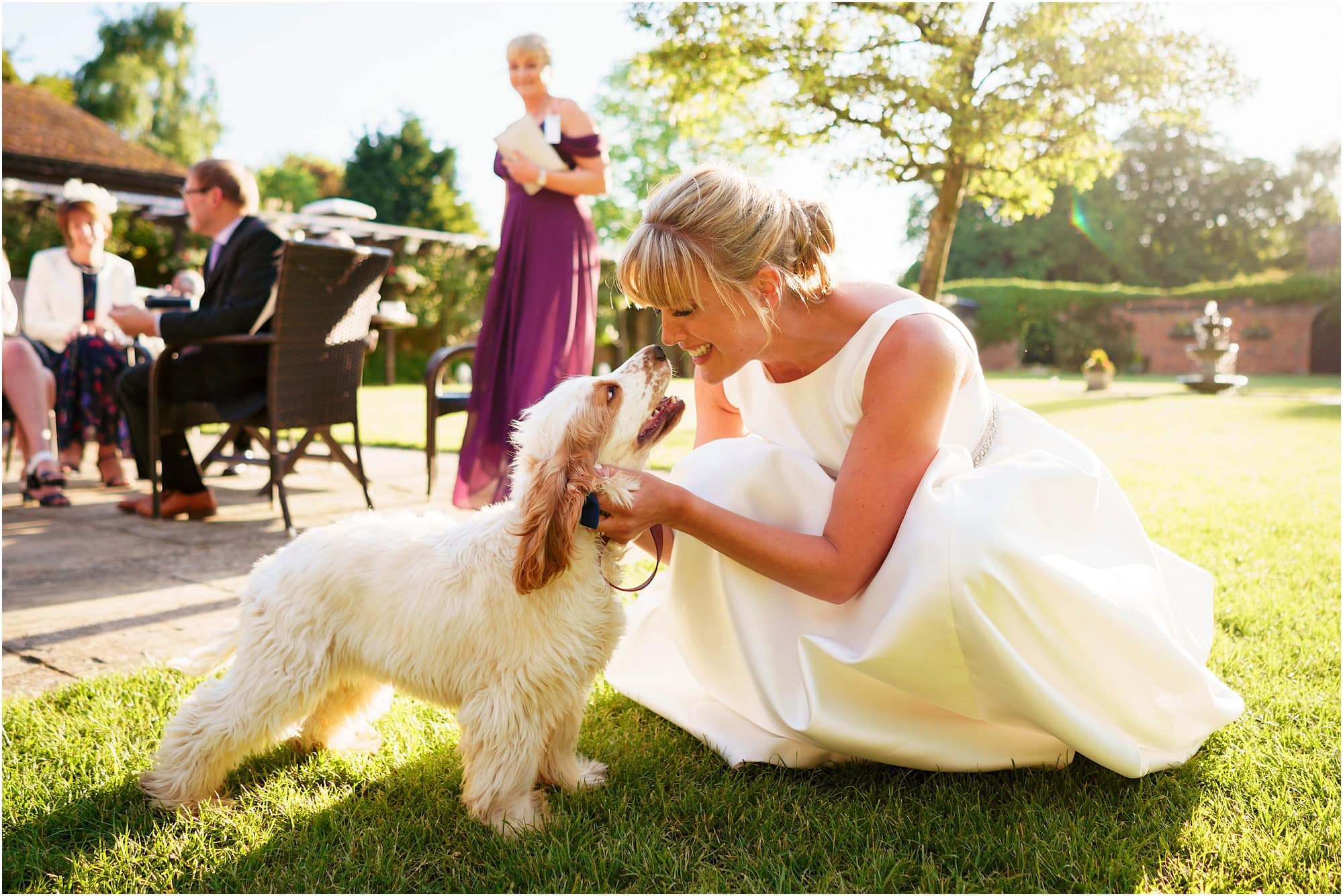 Bride and cocker spaniel puppy at Woodhall Manor