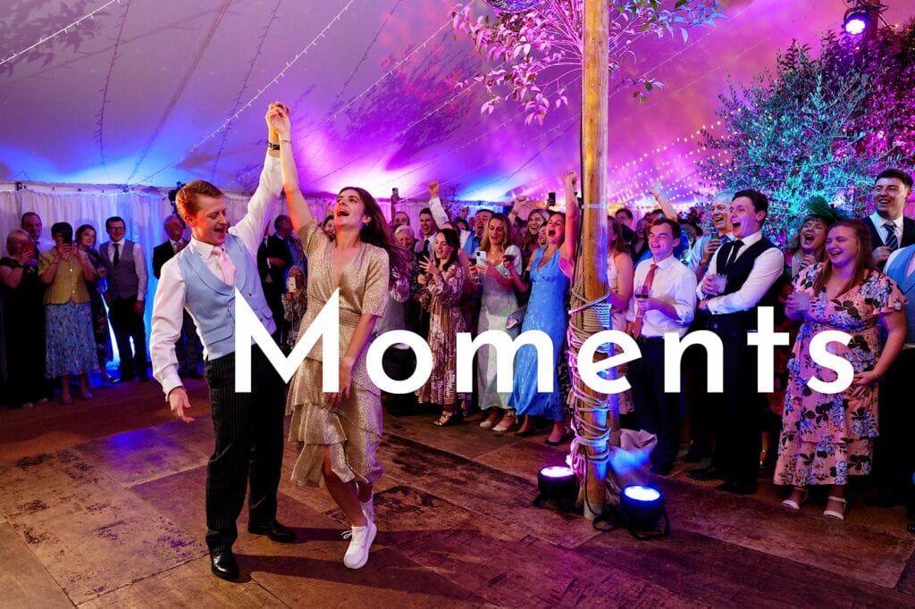 Moments button featuring a bride and groom dancing their first dance