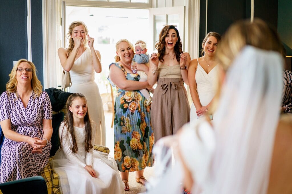Wedding guests reacting to seeing bride for first time