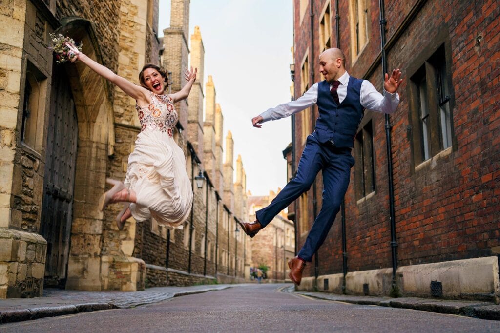 Wedding couple jumping in Cambridge