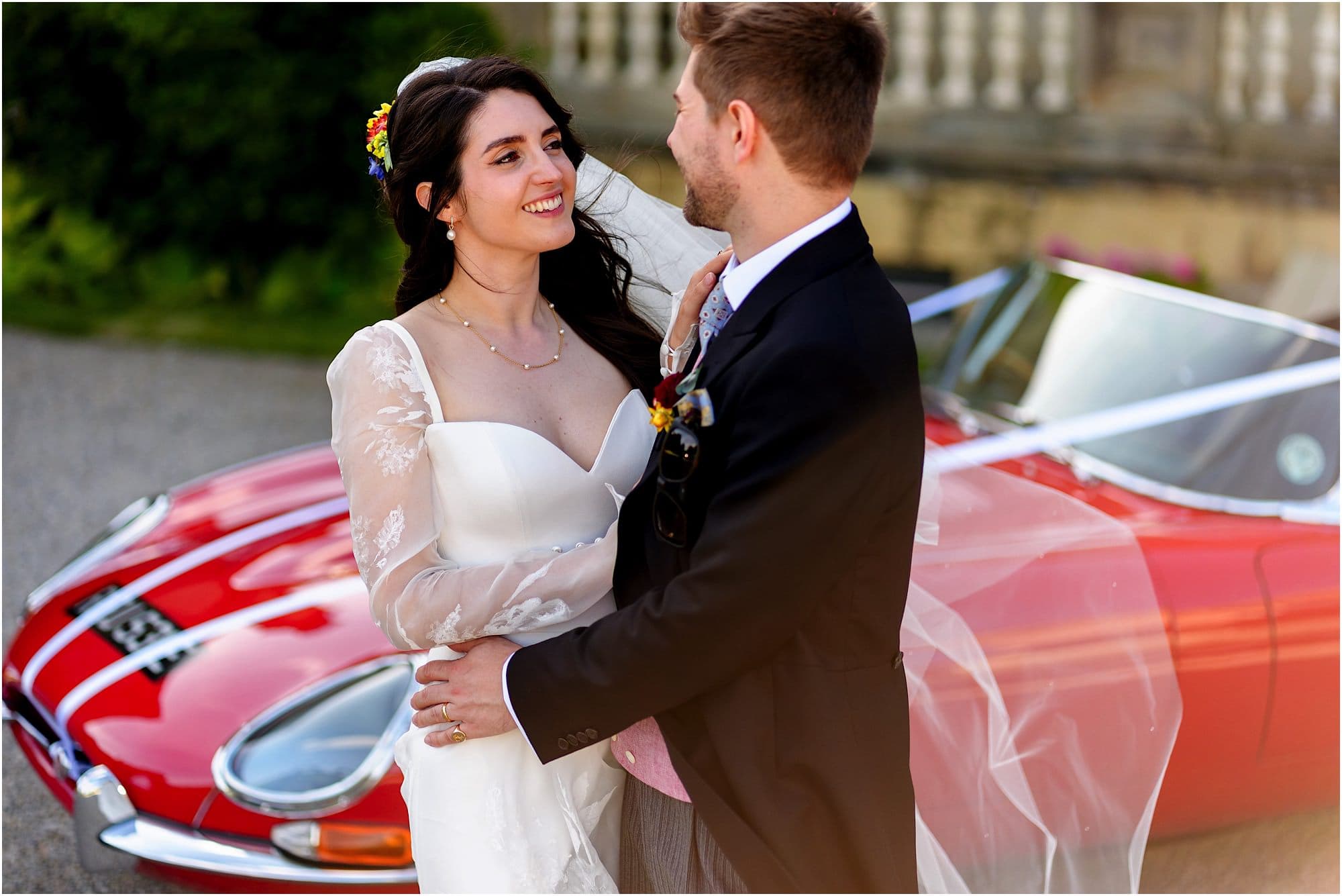 Birdsall House wedding photography Yorkshire in front of red e-type jag