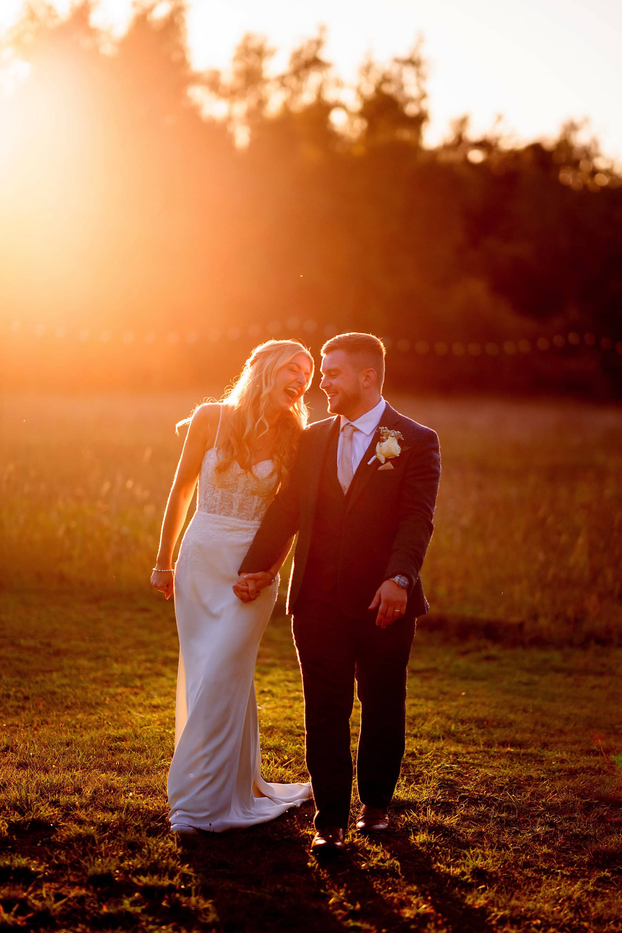 Natural beautiful moment at sunset between this bride and groom at a Wellington Wood wedding in Norfolk