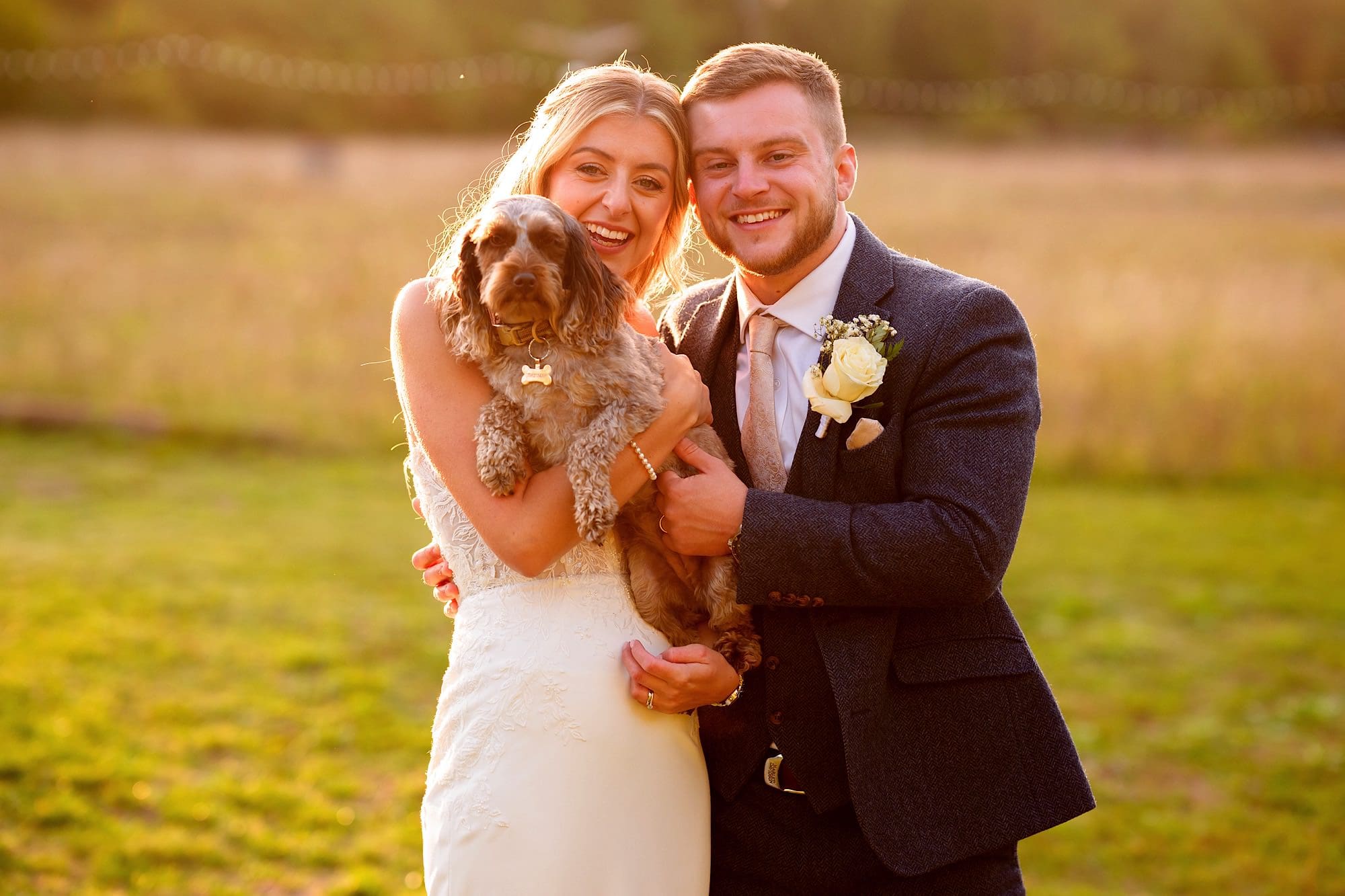 Bride and groom with their cute dog