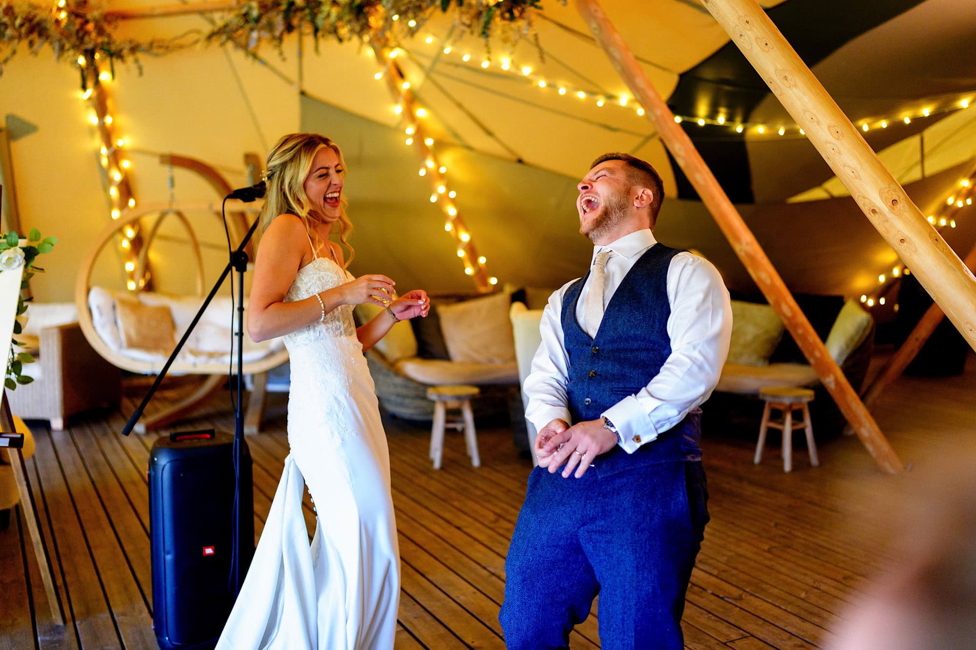 bride and groom laughing