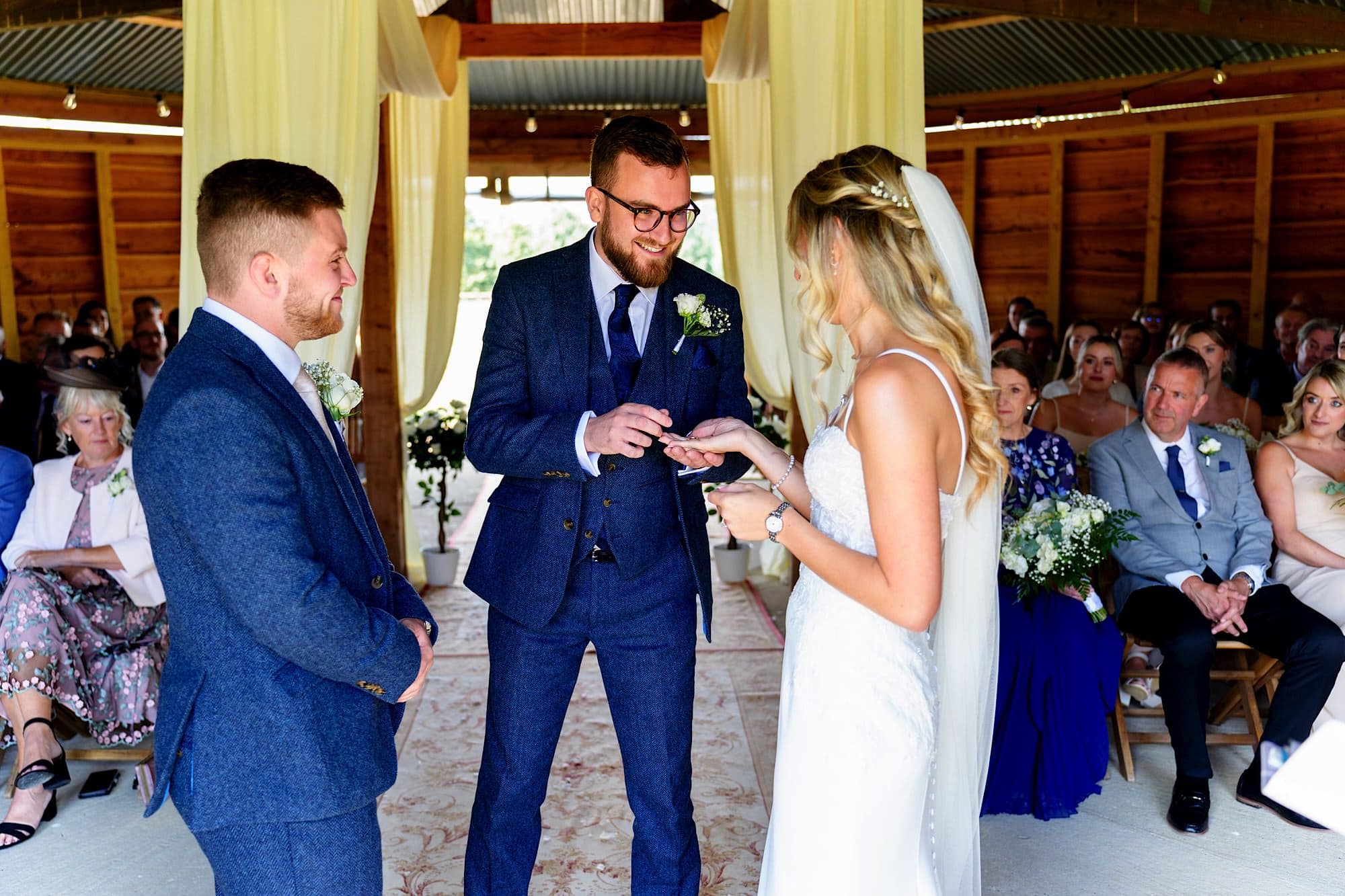 Best man giving the rings