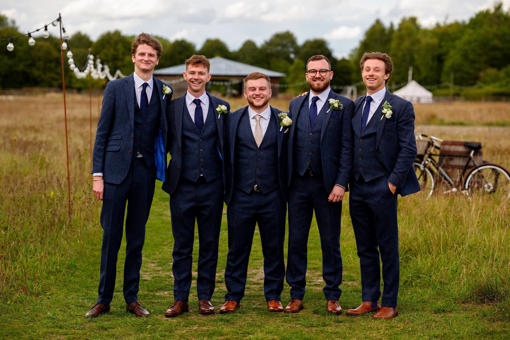 groomsman in navy suits